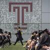 Student walking at Commencement